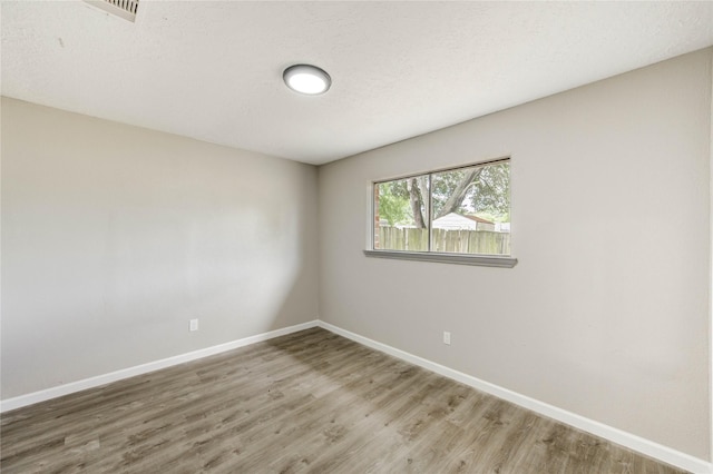 9627 Crooked Wood Ln, Houston, TX 77086 - empty room featuring light wood-style flooring and baseboards