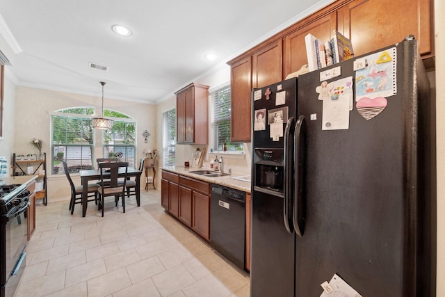 2816 Sand Dune Dr, Seabrook, TX 77586 - kitchen with black appliances, ornamental molding, brown cabinetry, healthy amount of natural light, and a sink