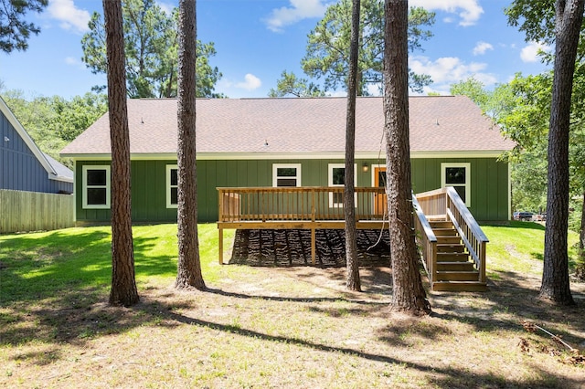 701 Sandy Brook Dr, Lufkin, TX 75901 - rear view of house featuring a wooden deck, a shingled roof, stairs, a yard, and board and batten siding
