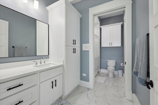 111 Poncho St, Anahuac, TX 77514 - full bathroom featuring marble finish flooring, baseboards, vanity, and toilet