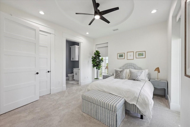 111 Poncho St, Anahuac, TX 77514 - bedroom featuring light carpet, recessed lighting, baseboards, connected bathroom, and ceiling fan