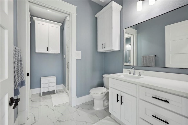 111 Poncho St, Anahuac, TX 77514 - bathroom with a heating unit, baseboards, vanity, marble finish flooring, and toilet