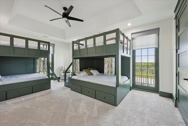 111 Poncho St, Anahuac, TX 77514 - bedroom with carpet floors, access to exterior, a tray ceiling, recessed lighting, and a ceiling fan