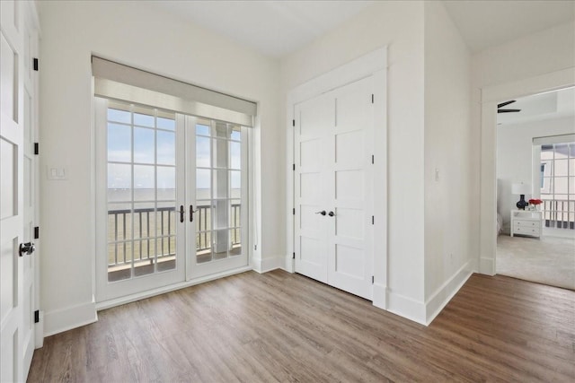111 Poncho St, Anahuac, TX 77514 - entryway featuring wood finished floors, baseboards, and french doors