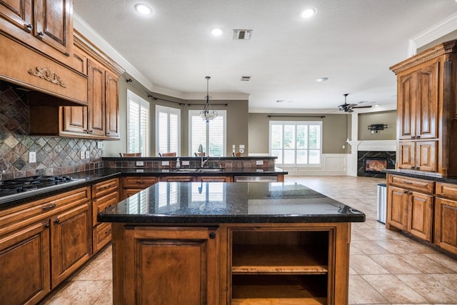 5925 Oak Leaf Ct, Conroe, TX 77304 - kitchen featuring open shelves, ornamental molding, stainless steel appliances, a high end fireplace, and ceiling fan