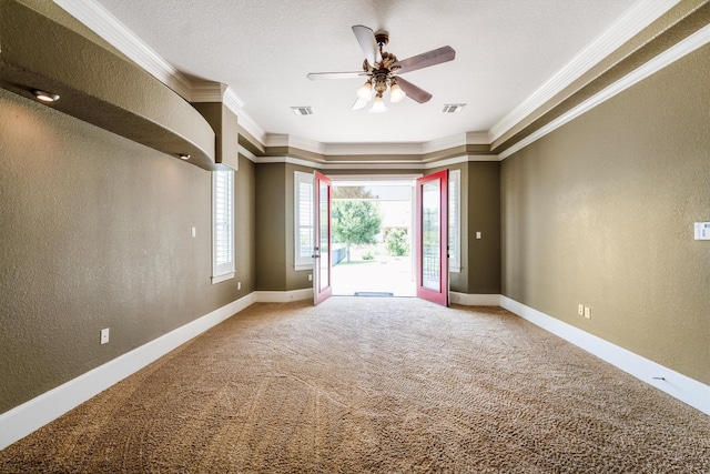 5925 Oak Leaf Ct, Conroe, TX 77304 - carpeted spare room featuring ornamental molding, a textured wall, ceiling fan, and baseboards