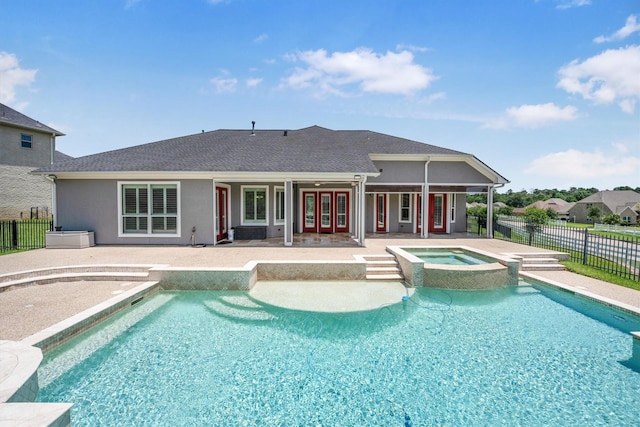 5925 Oak Leaf Ct, Conroe, TX 77304 - view of pool with french doors, a patio area, and a pool with connected hot tub