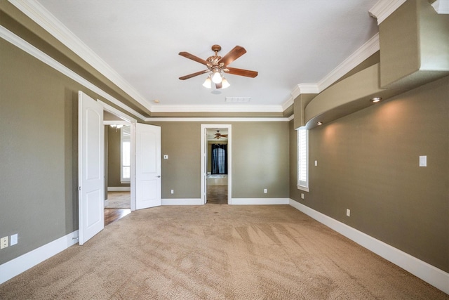 5925 Oak Leaf Ct, Conroe, TX 77304 - carpeted empty room featuring a ceiling fan, ornamental molding, and plenty of natural light