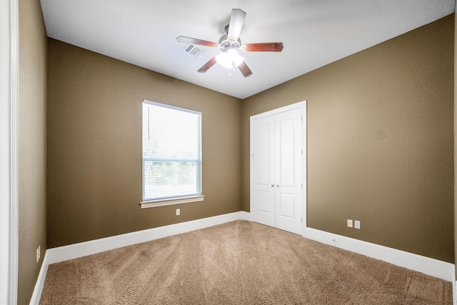 5925 Oak Leaf Ct, Conroe, TX 77304 - unfurnished bedroom with carpet floors, a closet, and ceiling fan