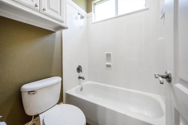 5925 Oak Leaf Ct, Conroe, TX 77304 - bathroom with toilet, shower / bathtub combination, and a textured wall