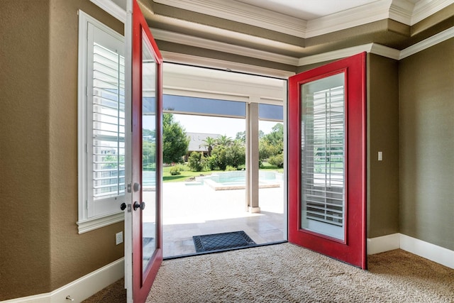 5925 Oak Leaf Ct, Conroe, TX 77304 - entrance foyer featuring carpet floors, french doors, ornamental molding, and baseboards