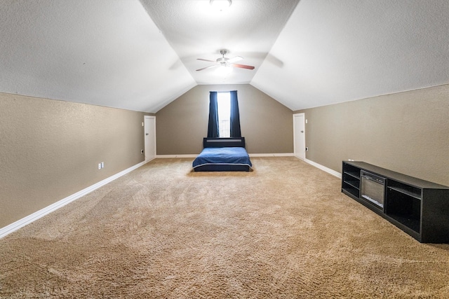 5925 Oak Leaf Ct, Conroe, TX 77304 - bonus room with ceiling fan, carpet floors, lofted ceiling, and a textured wall