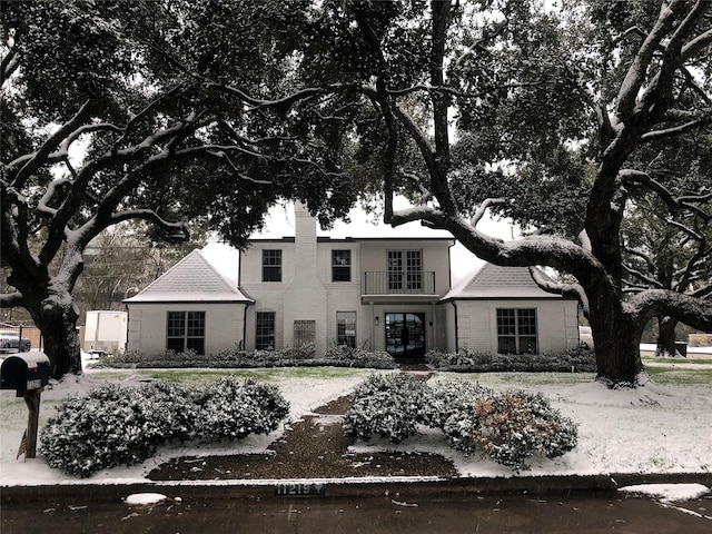 11219 Lorton Dr, Houston, TX 77070 - view of front of house featuring french doors, a balcony, and brick siding