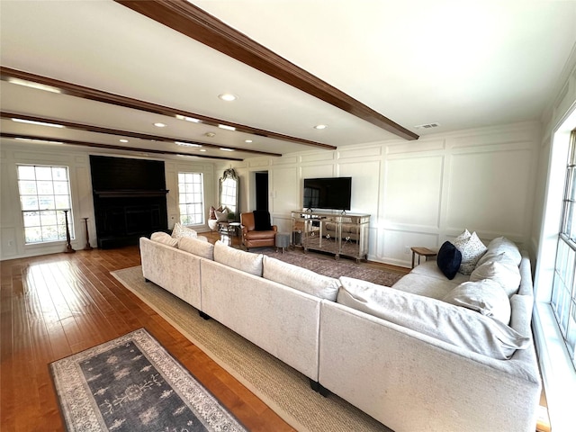 11219 Lorton Dr, Houston, TX 77070 - living area with a decorative wall, hardwood / wood-style floors, beamed ceiling, a fireplace, and recessed lighting