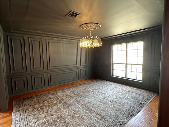 11219 Lorton Dr, Houston, TX 77070 - spare room featuring a chandelier and light wood-type flooring