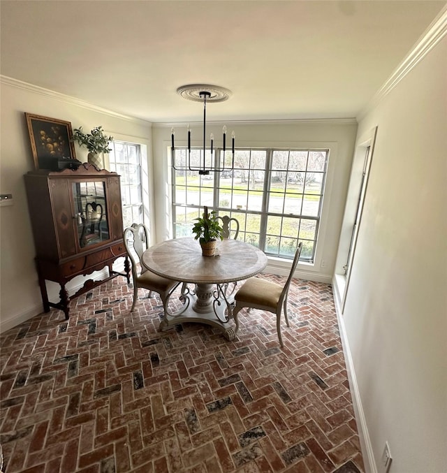 11219 Lorton Dr, Houston, TX 77070 - dining space with brick floors, baseboards, and crown molding