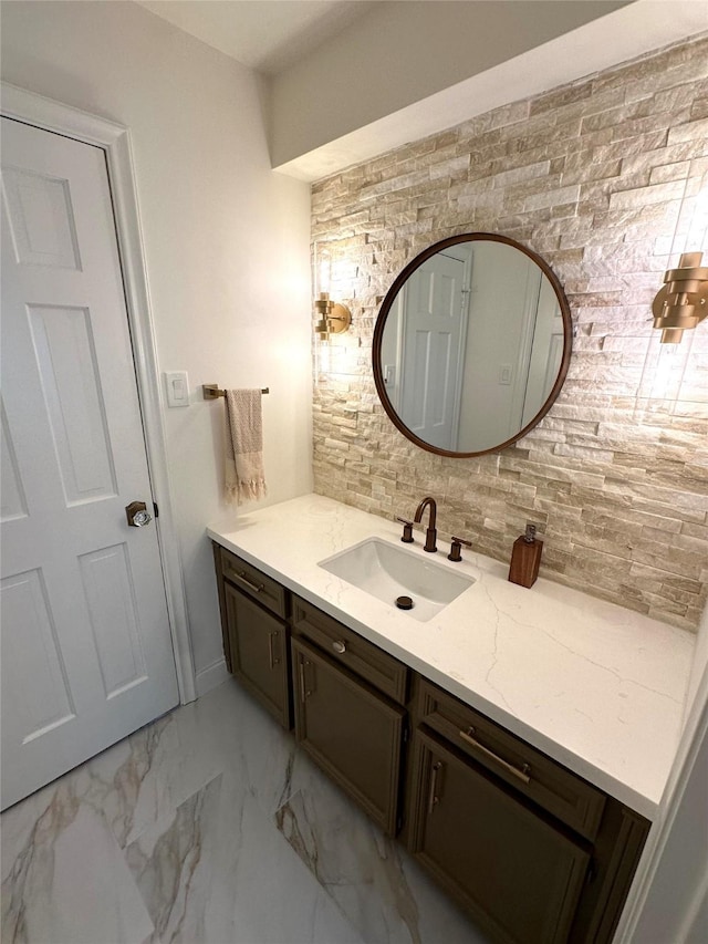 11219 Lorton Dr, Houston, TX 77070 - bathroom featuring vanity, decorative backsplash, and marble look tile flooring