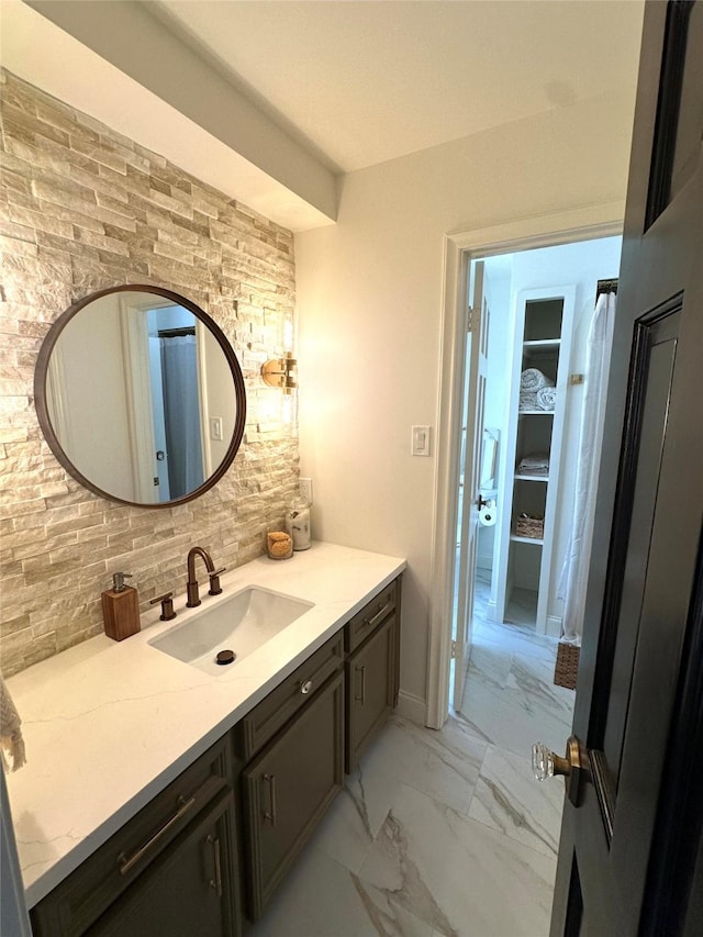 11219 Lorton Dr, Houston, TX 77070 - bathroom with marble finish floors, vanity, and tasteful backsplash