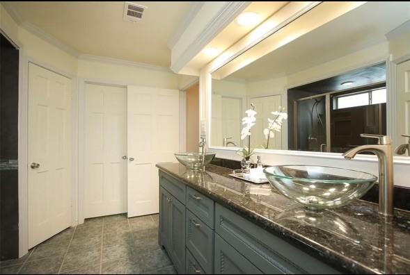 11219 Lorton Dr, Houston, TX 77070 - bathroom featuring double vanity and ornamental molding
