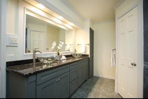11219 Lorton Dr, Houston, TX 77070 - full bath with double vanity, crown molding, tile patterned flooring, and baseboards
