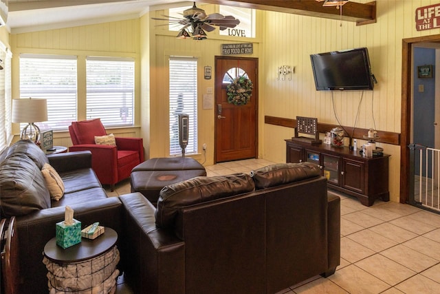 712 Birch Hollow Dr, Somerville, TX 77879 - living area with light tile patterned floors, a ceiling fan, and wood walls