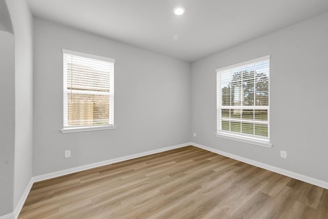 22807 Gentle Shadow Dr, Hockley, TX 77447 - unfurnished room with light wood-style floors, baseboards, and recessed lighting