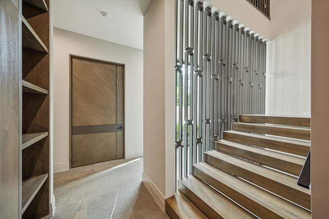 9010 Memorial Dr, Houston, TX 77024 - staircase featuring baseboards