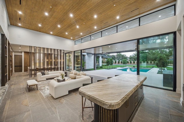 9010 Memorial Dr, Houston, TX 77024 - building lobby featuring a towering ceiling, wood ceiling, and recessed lighting