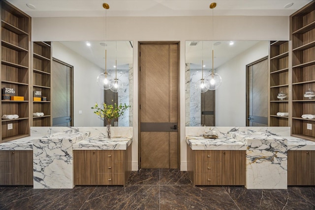 9010 Memorial Dr, Houston, TX 77024 - bathroom with marble tiled flooring, two vanities, and built in shelves