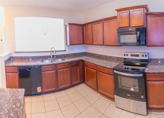 5123 Harbor Palm Dr, Rosenberg, TX 77469 - kitchen featuring black appliances, a sink, light tile patterned floors, and dark stone counters