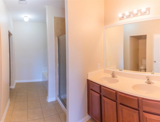 5123 Harbor Palm Dr, Rosenberg, TX 77469 - full bathroom with toilet, double vanity, tile patterned flooring, a shower with shower door, and a tub to relax in