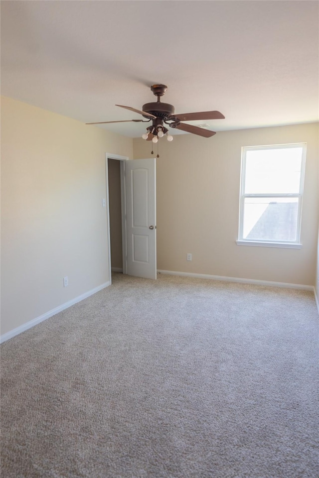 5123 Harbor Palm Dr, Rosenberg, TX 77469 - empty room featuring ceiling fan, baseboards, and light colored carpet