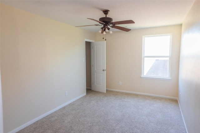 5123 Harbor Palm Dr, Rosenberg, TX 77469 - spare room with light colored carpet, ceiling fan, and baseboards