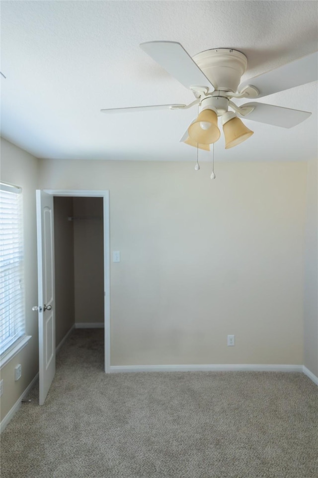 5123 Harbor Palm Dr, Rosenberg, TX 77469 - unfurnished bedroom with light carpet, ceiling fan, and baseboards
