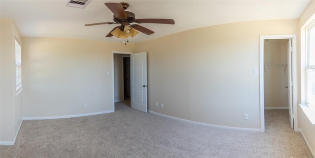 5123 Harbor Palm Dr, Rosenberg, TX 77469 - unfurnished bedroom featuring carpet floors, a spacious closet, and multiple windows