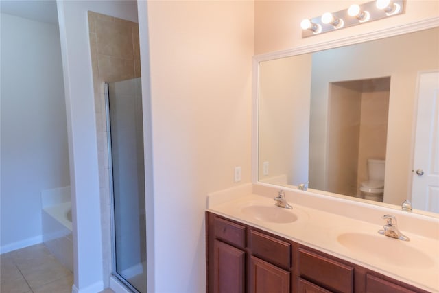 5123 Harbor Palm Dr, Rosenberg, TX 77469 - bathroom featuring toilet, a stall shower, double vanity, a bath, and tile patterned floors