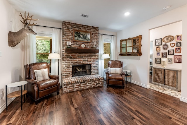 1812 Camellia Dr, Huntsville, TX 77340 - living area featuring wood finished floors and a fireplace
