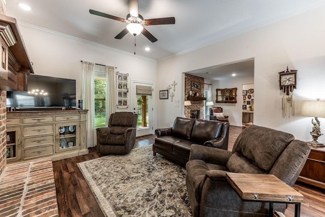 1812 Camellia Dr, Huntsville, TX 77340 - living room with a brick fireplace, ceiling fan, wood finished floors, ornamental molding, and recessed lighting