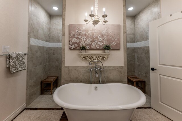 1812 Camellia Dr, Huntsville, TX 77340 - full bathroom with tile walls, a chandelier, a freestanding tub, walk in shower, and recessed lighting