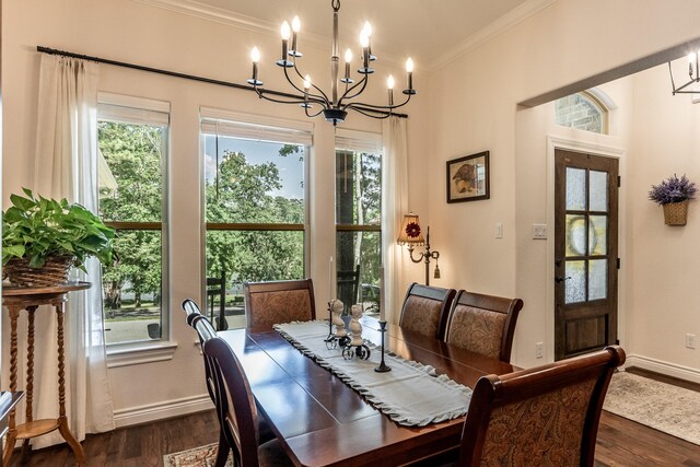 1812 Camellia Dr, Huntsville, TX 77340 - dining space featuring crown molding, a chandelier, and dark wood-style flooring