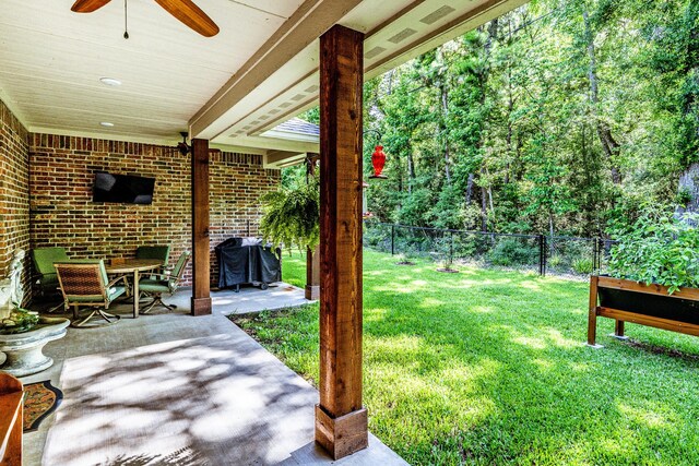 1812 Camellia Dr, Huntsville, TX 77340 - view of yard featuring a ceiling fan and a patio area