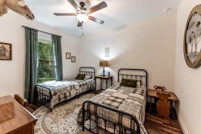 1812 Camellia Dr, Huntsville, TX 77340 - bedroom featuring wood finished floors and ceiling fan