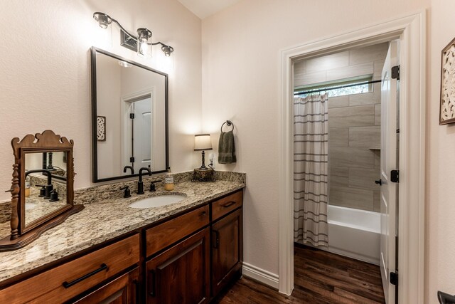 1812 Camellia Dr, Huntsville, TX 77340 - bathroom with vanity, wood finished floors, and shower / bathtub combination with curtain