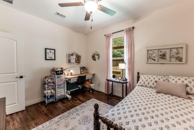 1812 Camellia Dr, Huntsville, TX 77340 - bedroom with wood finished floors, a desk, and a ceiling fan