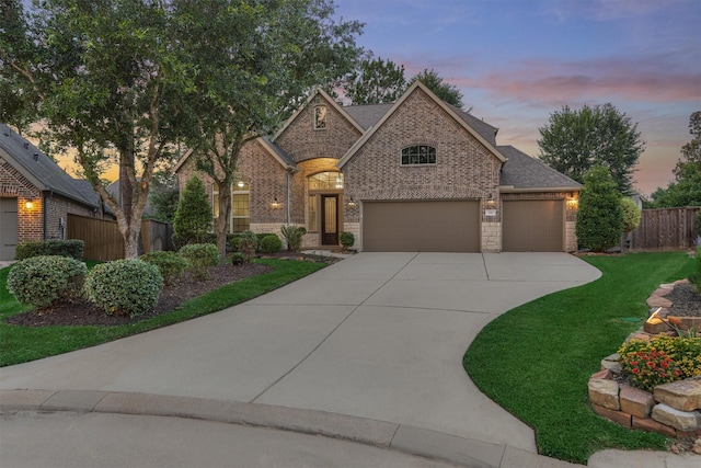 114 Cedar Brush Ct, Montgomery, TX 77316 - french provincial home with brick siding, driveway, a garage, and a shingled roof
