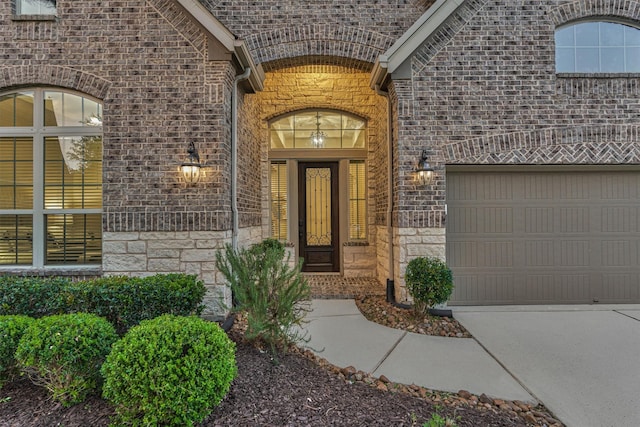 114 Cedar Brush Ct, Montgomery, TX 77316 - entrance to property featuring stone siding, brick siding, concrete driveway, and an attached garage