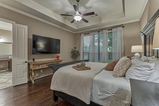 114 Cedar Brush Ct, Montgomery, TX 77316 - bedroom with a tray ceiling, dark wood-type flooring, ornamental molding, and a ceiling fan