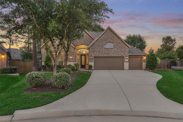 114 Cedar Brush Ct, Montgomery, TX 77316 - view of front of property with brick siding, driveway, an attached garage, and roof with shingles