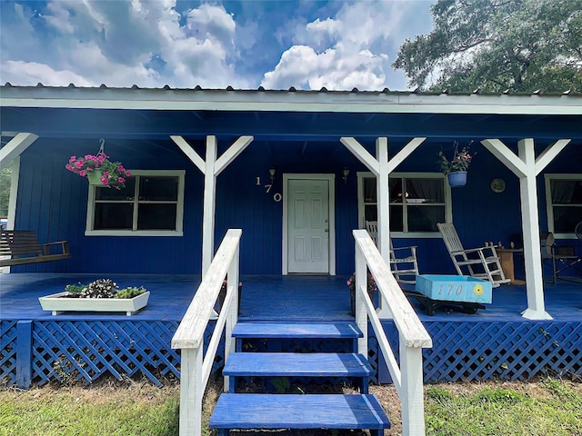 170 Trails End Dr, Cleveland, TX 77328 - property entrance with a porch and a metal roof