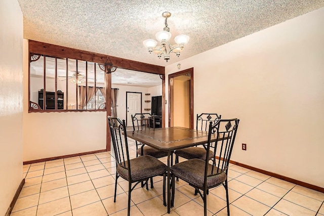 170 Trails End Dr, Cleveland, TX 77328 - dining room with a chandelier, light tile patterned flooring, and a textured ceiling